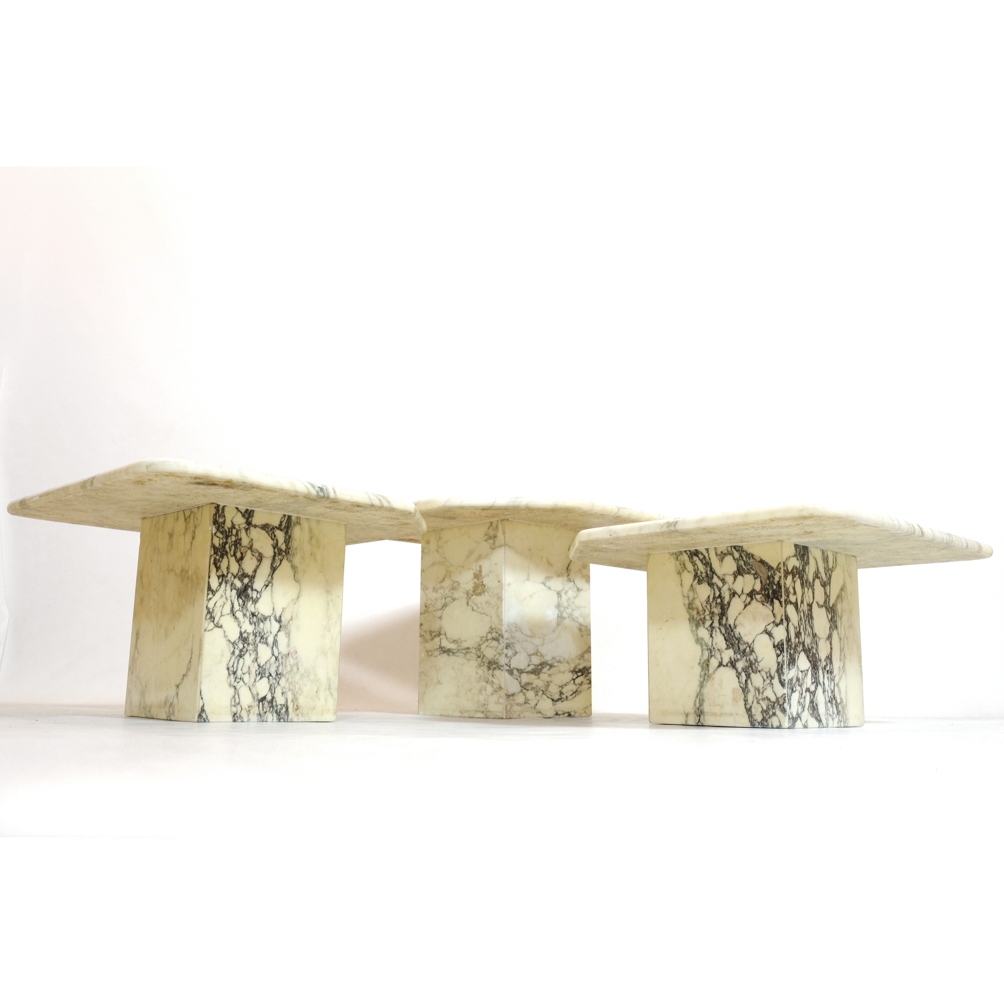 Suite of three marble trundle tables, 1970s