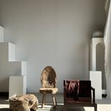 Small low armchair in varnished brown wood