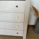 Restored wooden art deco chest of drawers with gilded handles