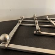Paire de dessous de plat anciens extensibles métal argenté 1940