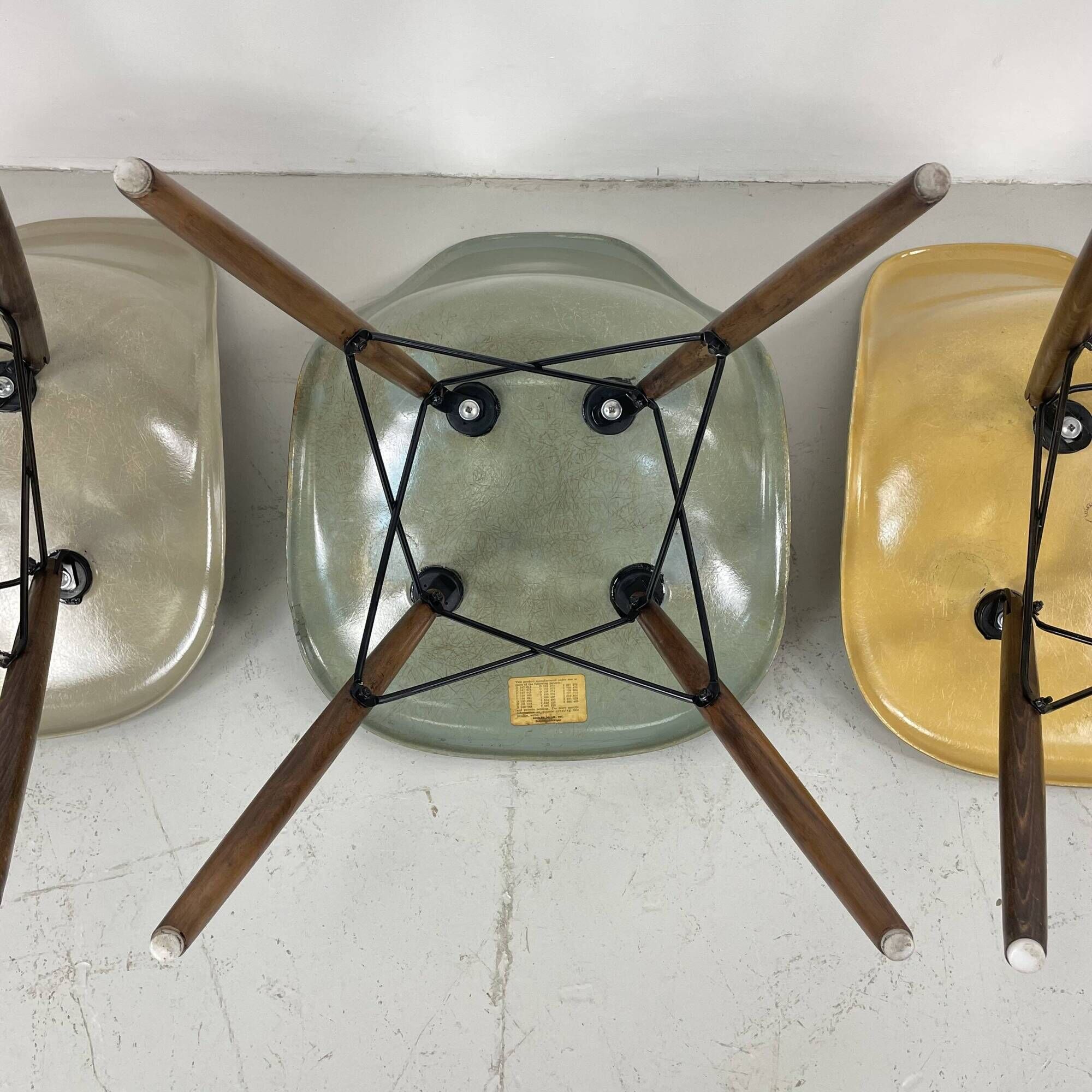 Eames Herman Miller DSW side chairs in greige, seafoam green, light ochre and parchment with slight