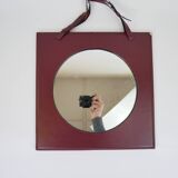 Mirror covered in burgundy leather