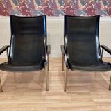 Set of 2 black leather and chrome reclining chairs designed by Hans Eichenberger.