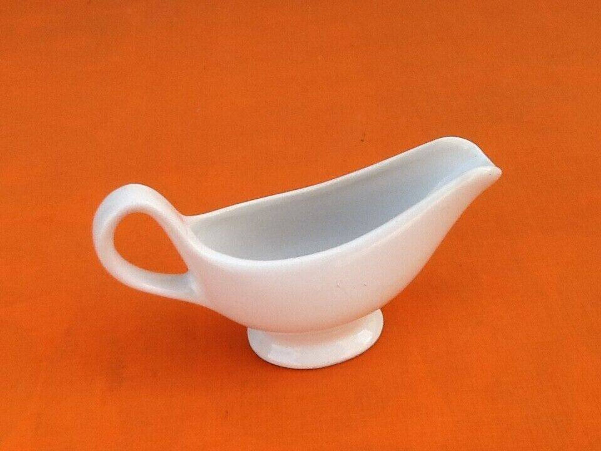 White porcelain gravy boat, fruit basket decor
