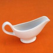 White porcelain gravy boat, fruit basket decor
