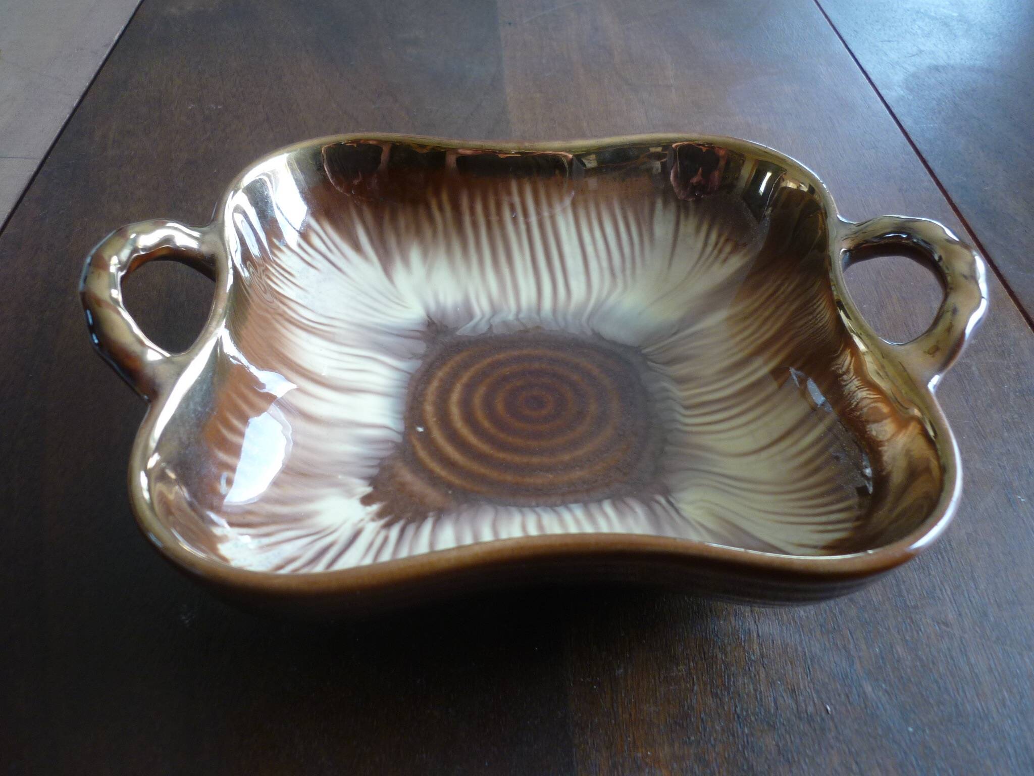 Square dish with brown and gold handles