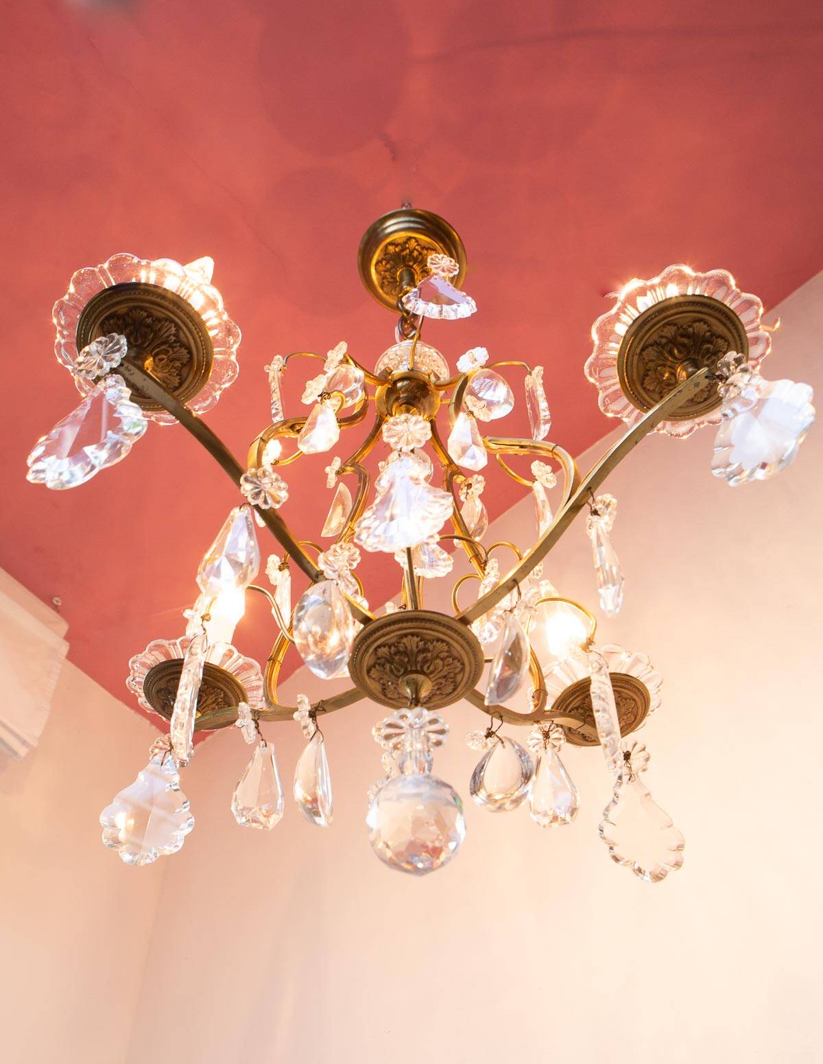 Old French chandelier in gilded brass with tassels
