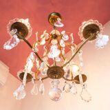 Old French chandelier in gilded brass with tassels