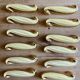 Set of 12 vintage art deco yellow and gold ceramic knife rests