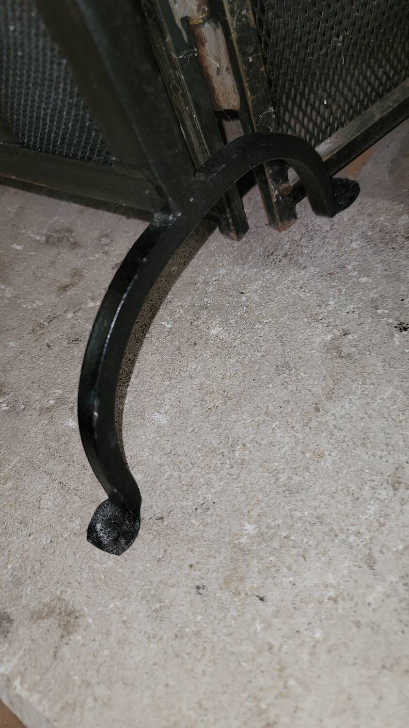 Black metal firewall decorated with animals