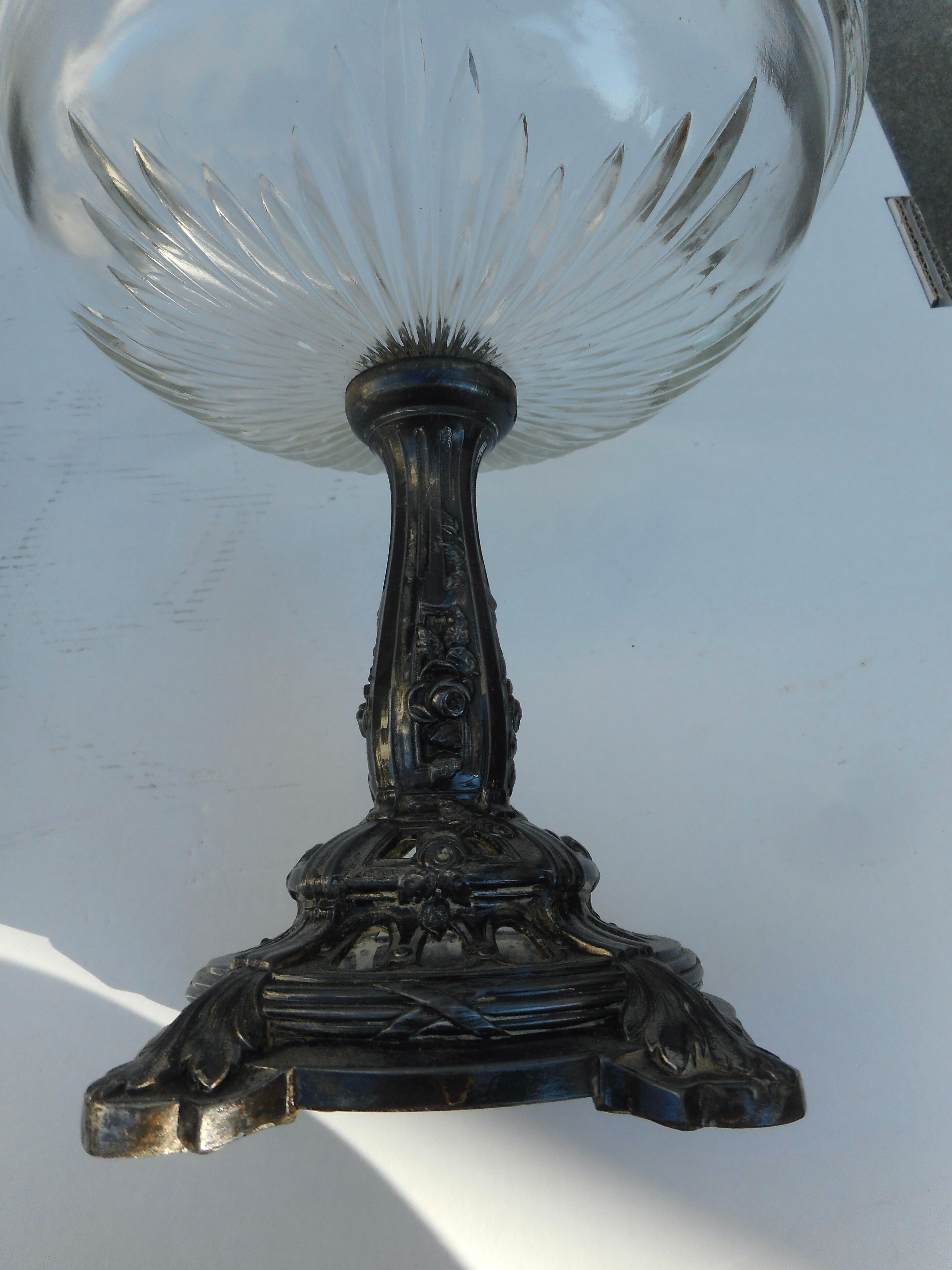 A glass cup on metal stand