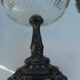 A glass cup on metal stand