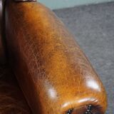 Dark wingback armchair made of sheep leather with stunning colors