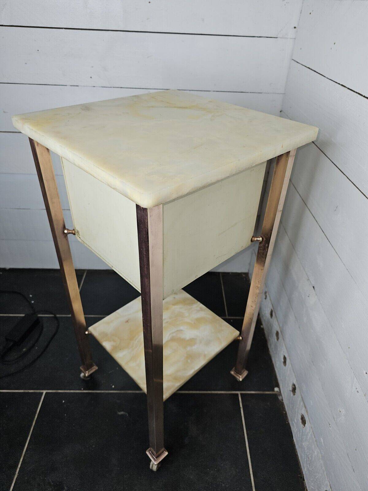 Bedside table in patinated iron, brass and marble tops