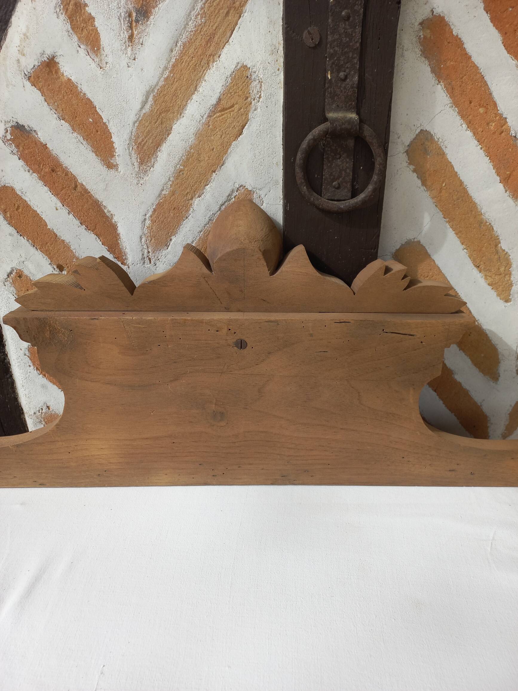 Old sandblasted wooden pediment