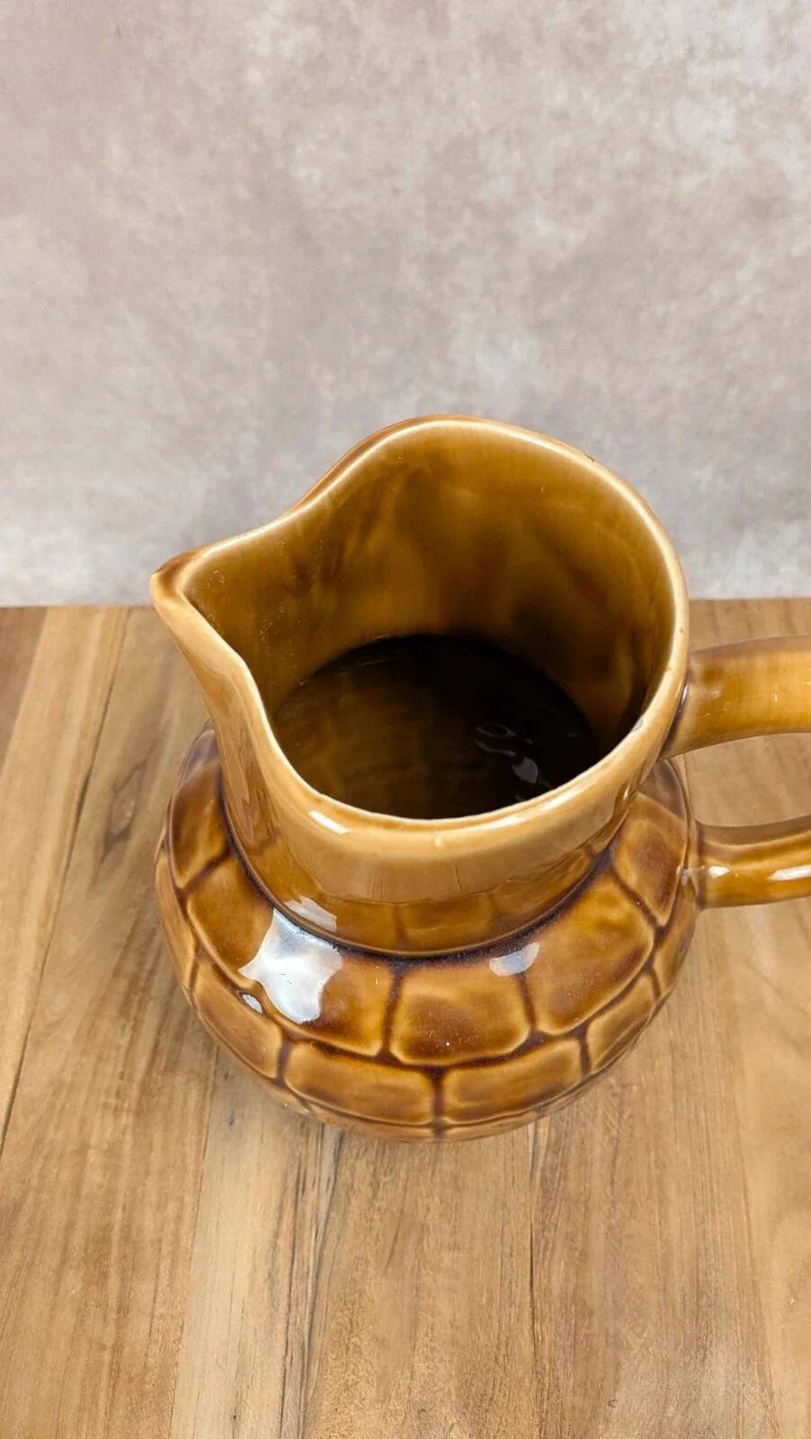 Vintage Sarreguemines pitcher with brown relief decoration.