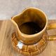 Vintage Sarreguemines pitcher with brown relief decoration.