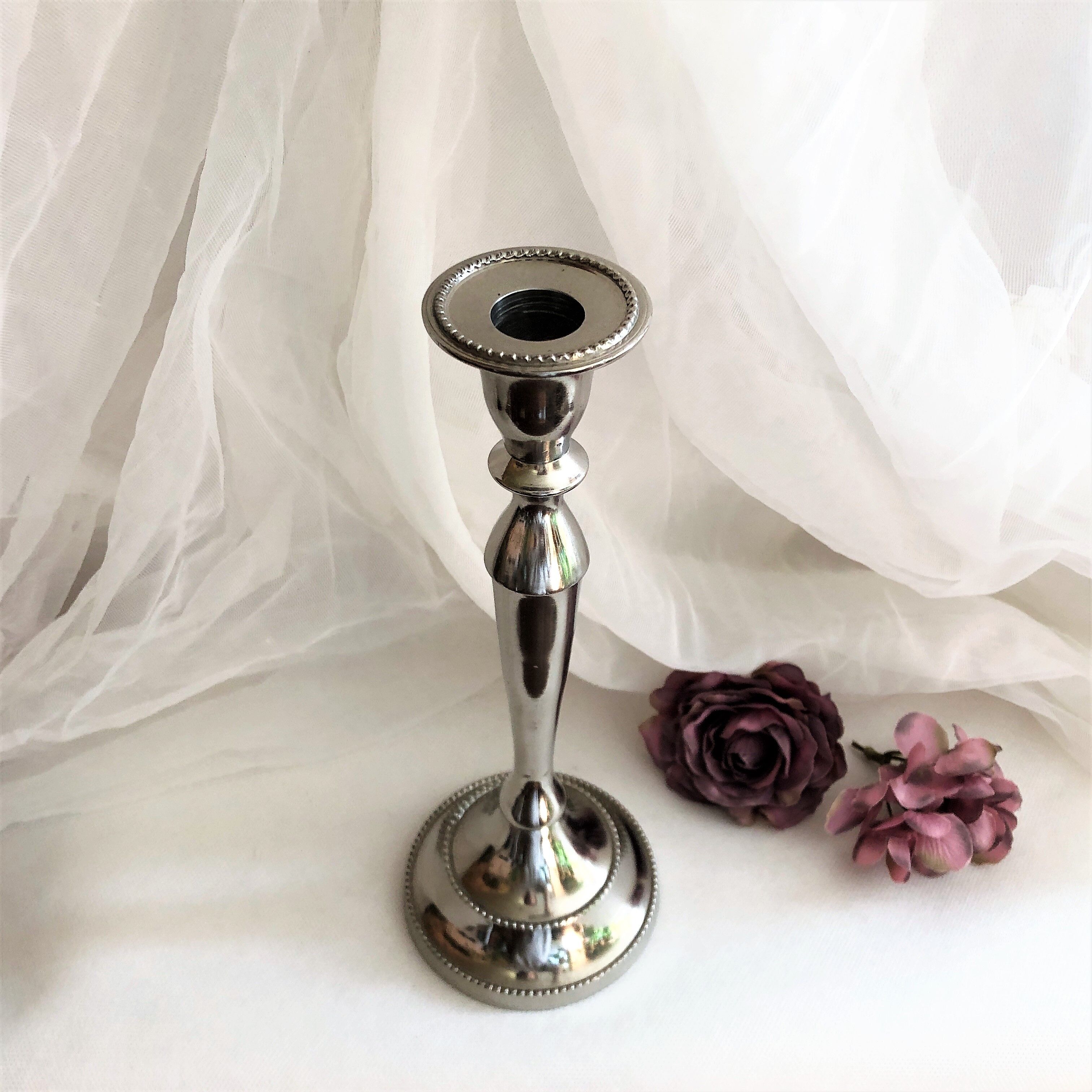 Chromed metal candle holder