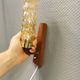 A set of Danish wall lights in champagne coloured glass with brass and teak.