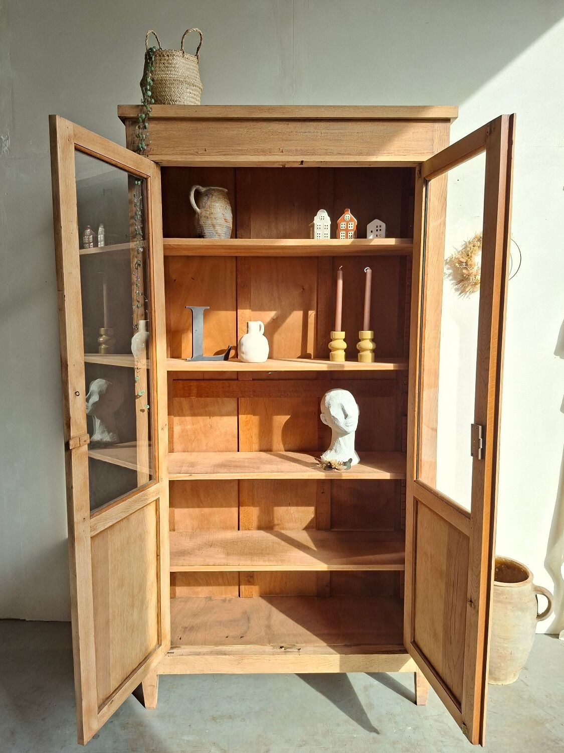 Large antique display cabinet in patinated solid oak.
