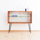 Teak display cabinet with black hairpin legs.
