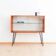 Teak display cabinet with black hairpin legs.