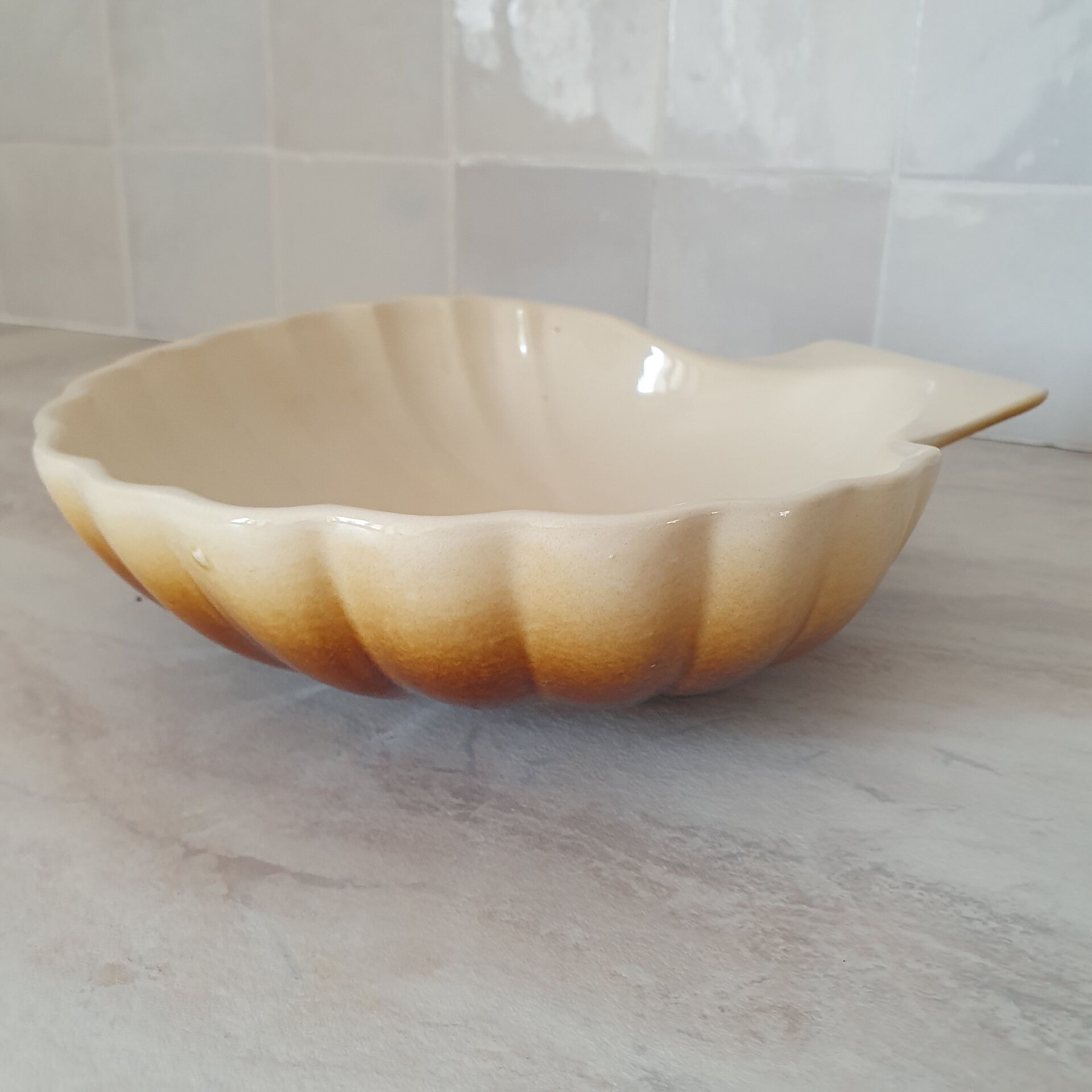 Brown and white ceramic shell bowl