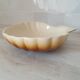 Brown and white ceramic shell bowl
