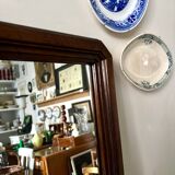 Full-length rectangular mirror in dark wood