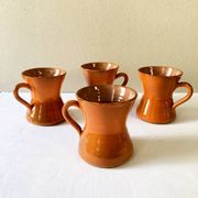 4 large orange enameled ceramic cups, signed