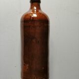 Old bottle in varnished ground.
