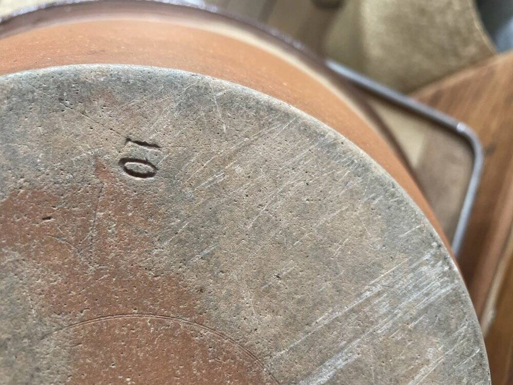 Antique spouted jug in terracotta