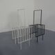 Steel magazine or record racks, 1960s, set of 2