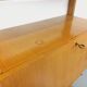 Wall shelf library with vintage light wood secretary bar