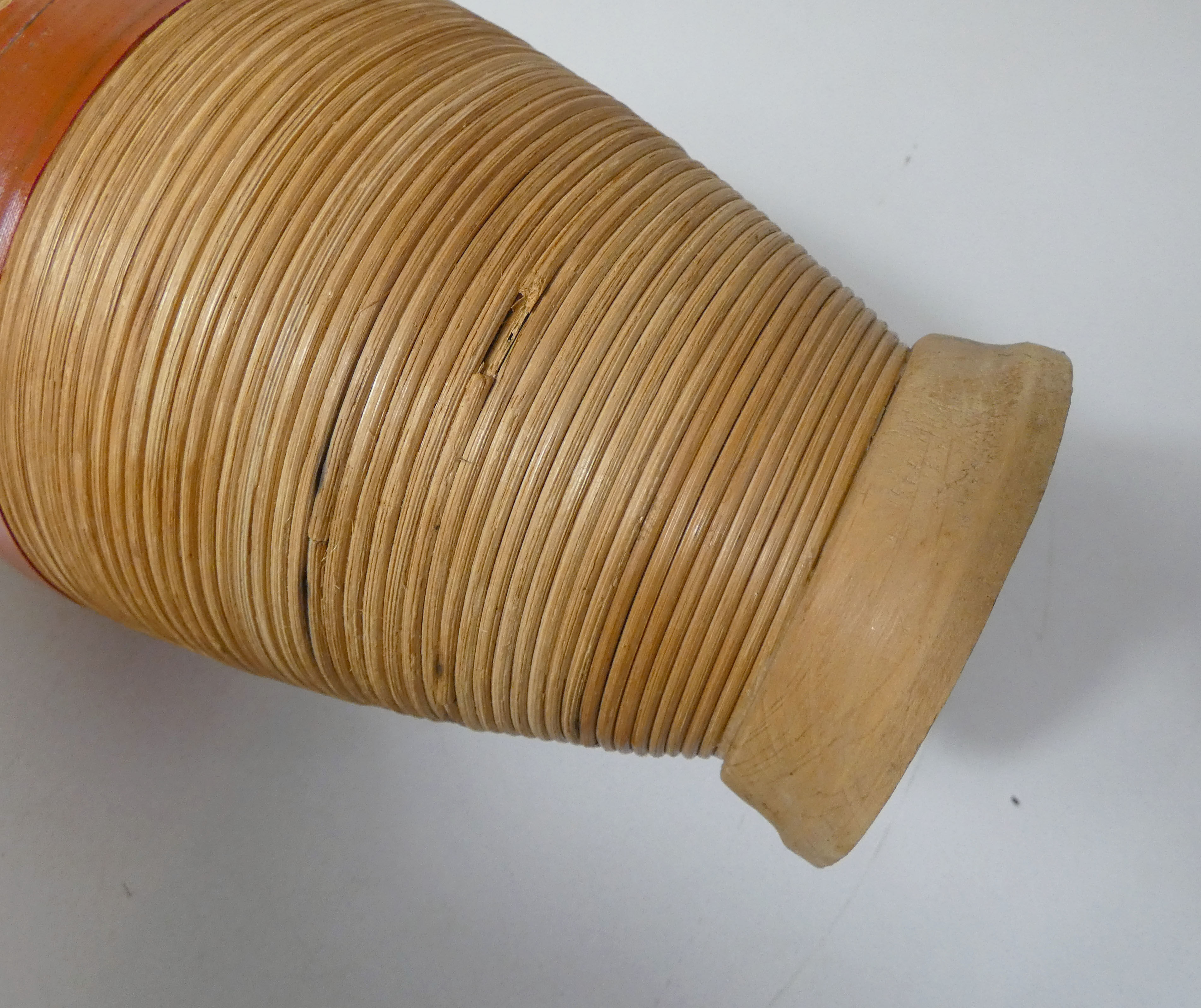 Old bottle dressed in vintage wood rattan