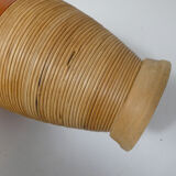 Old bottle dressed in vintage wood rattan
