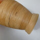 Old bottle dressed in vintage wood rattan