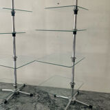 A pair of vintage side tables in glass and chrome metal.