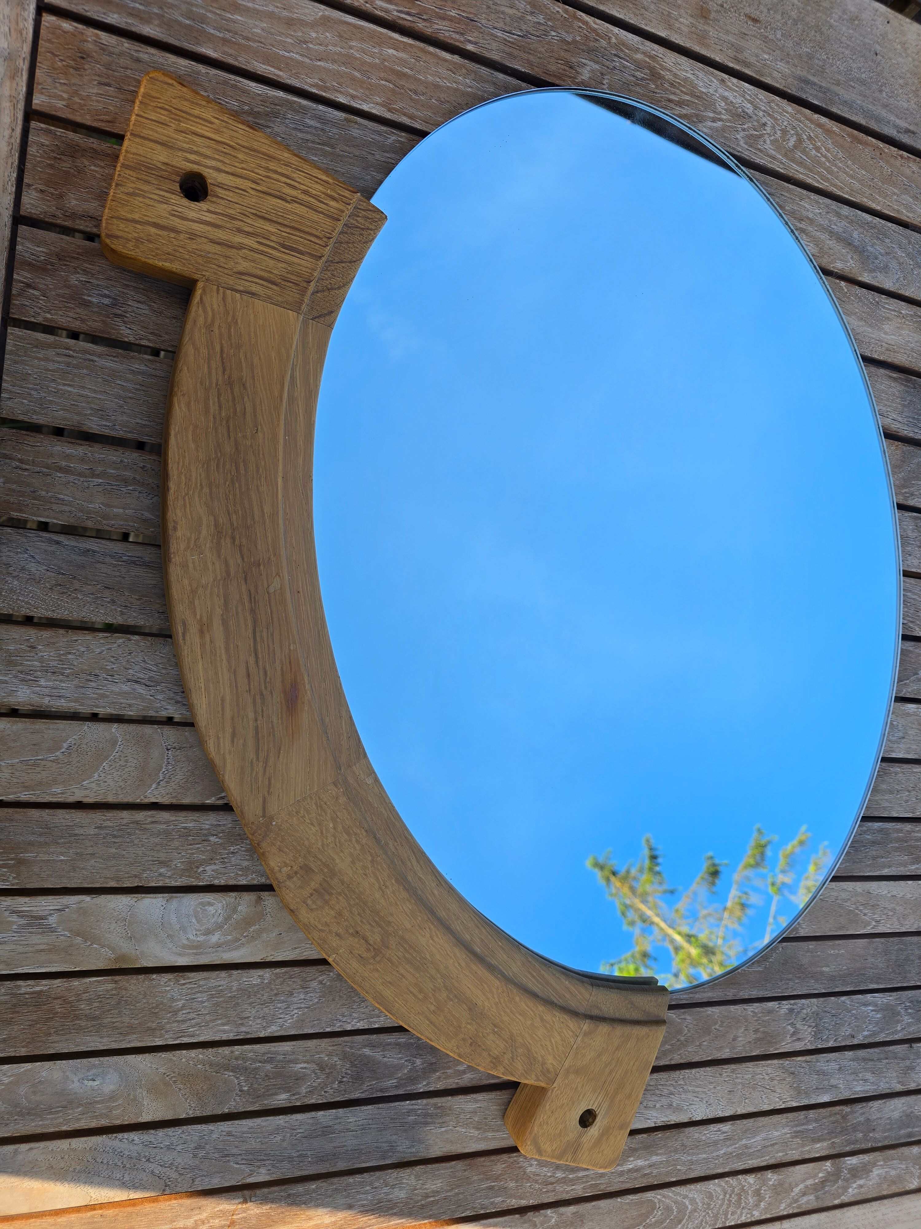 Oval mirror by Guillerme and Chambron