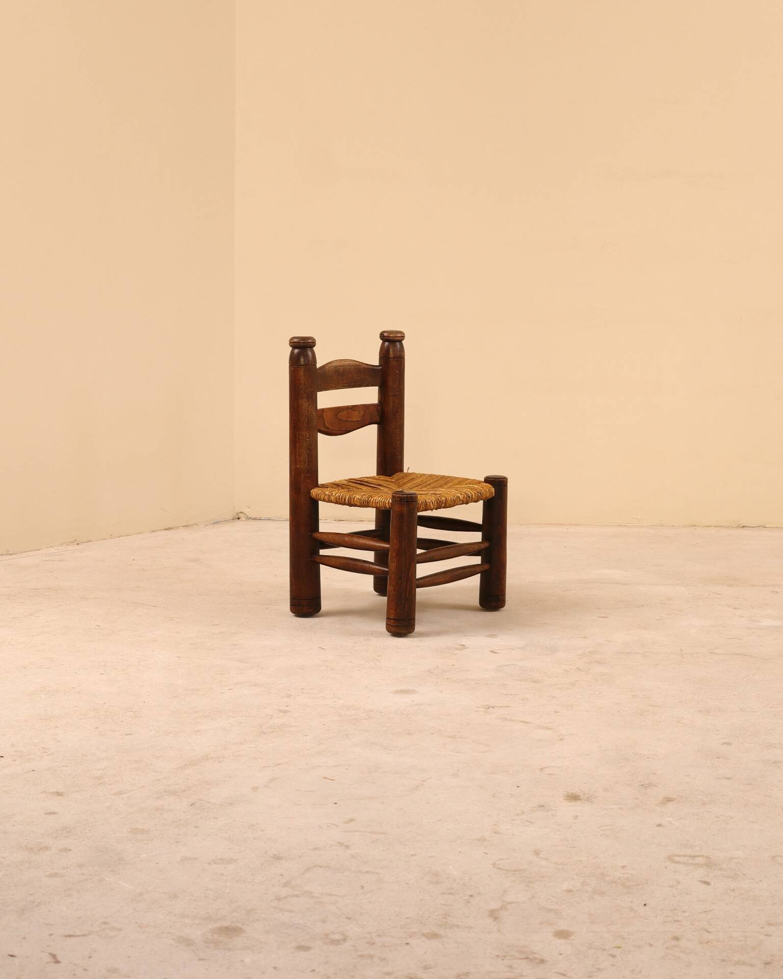 Low fireplace chair attributed to Charles Dudouyt.