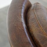Grained cowhide armchair with a timeless design