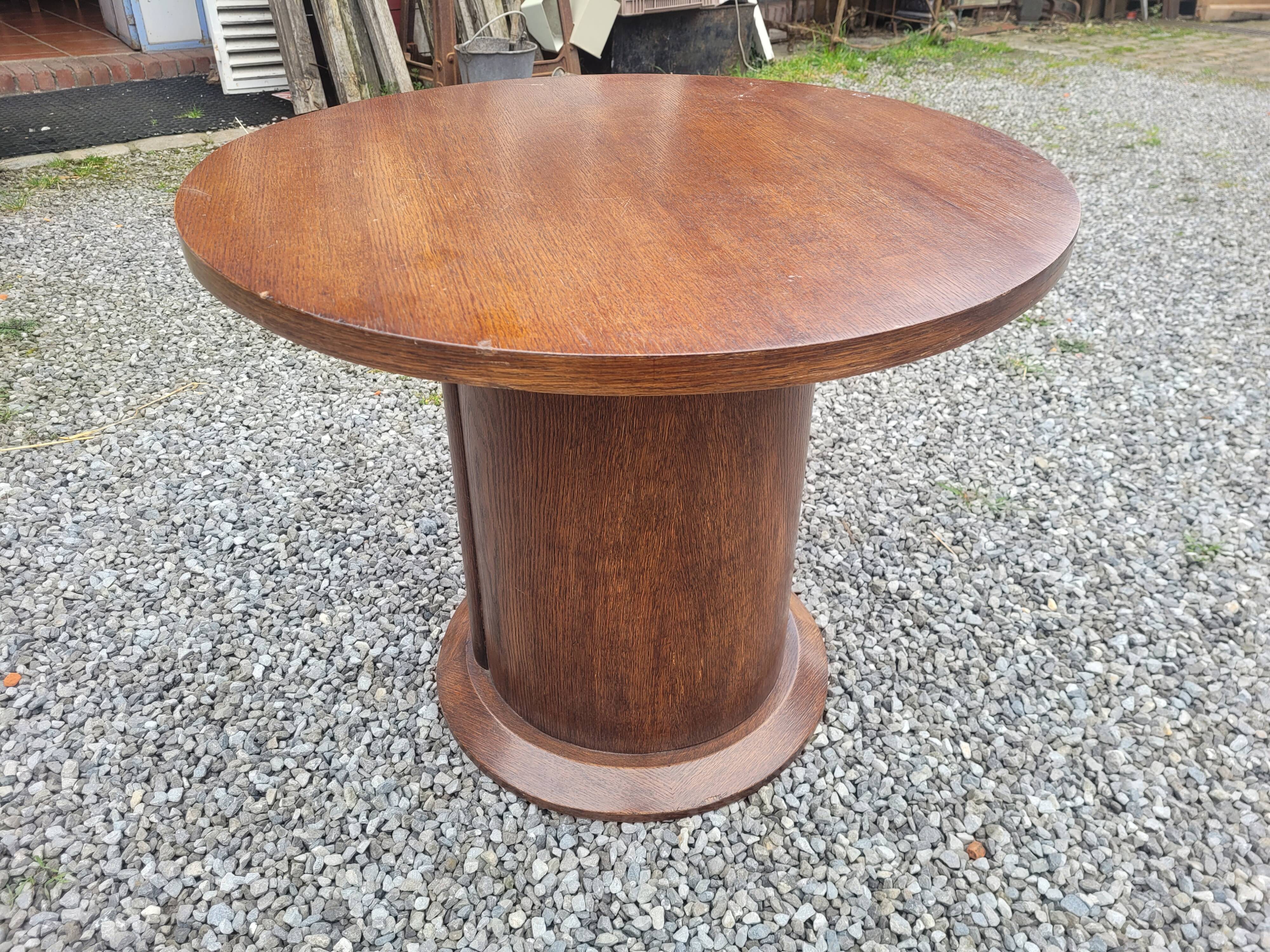 Vintage round oak coffee table with a door