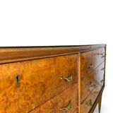 Veneered burl walnut chest of drawers with light warm brown glass top