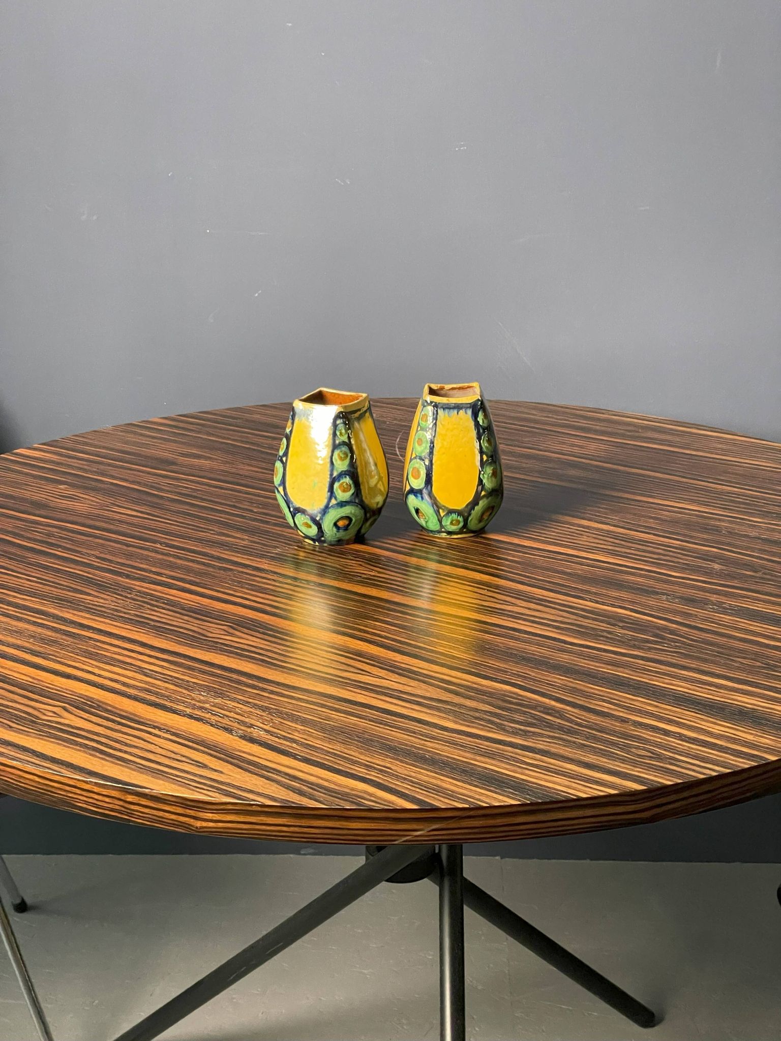 A pair of green and yellow vases