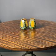 A pair of green and yellow vases