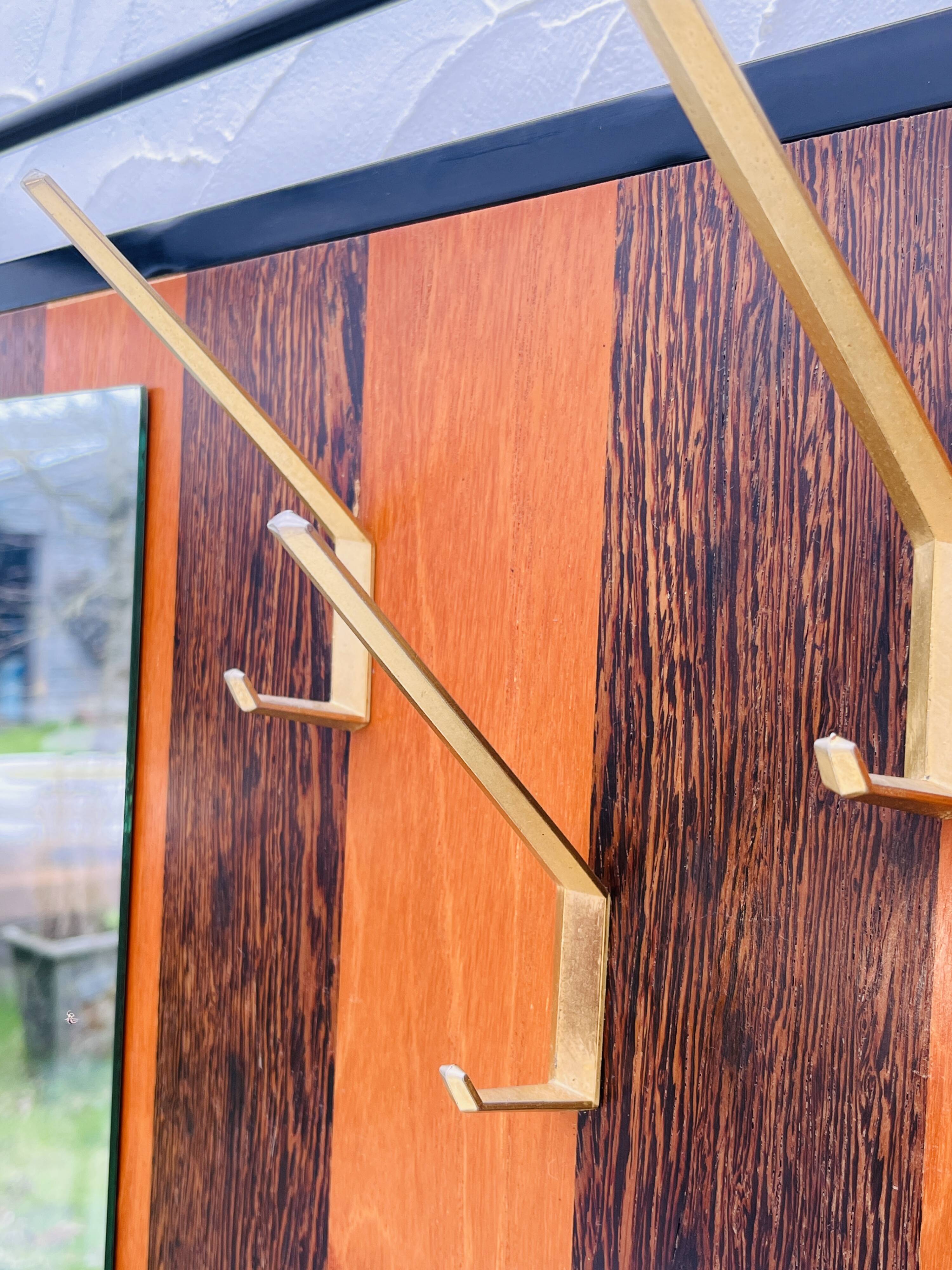 Vintage wall coat rack with storage bench from the 1970s.