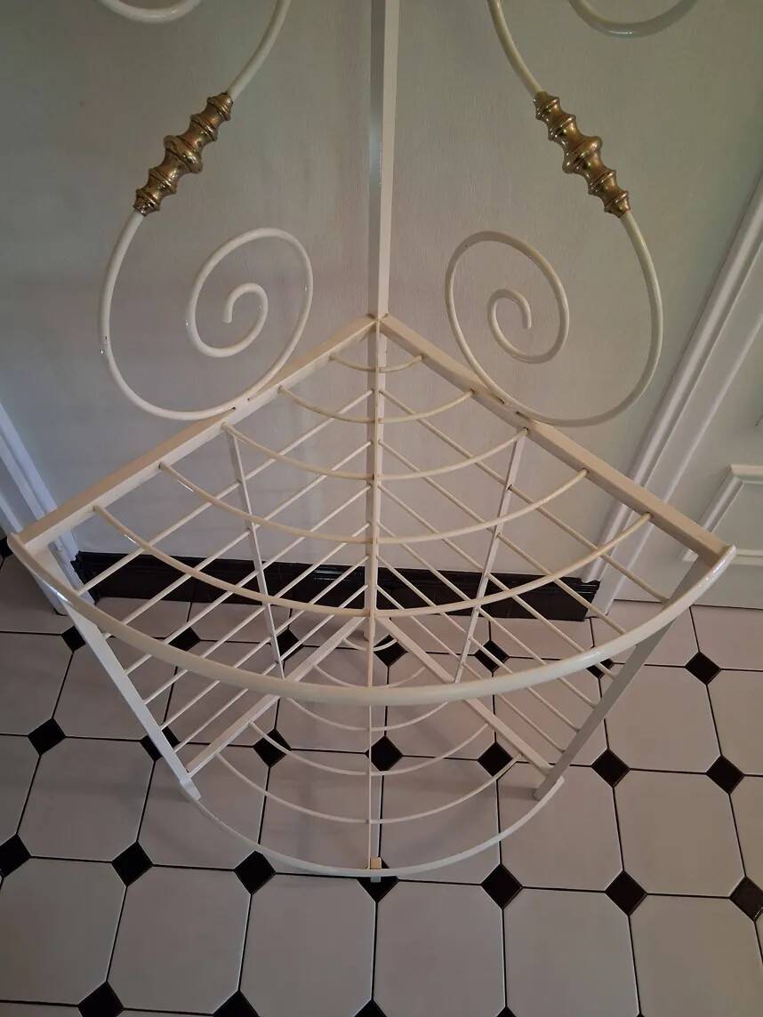 Cream and brass corner bakery shelf in wrought iron