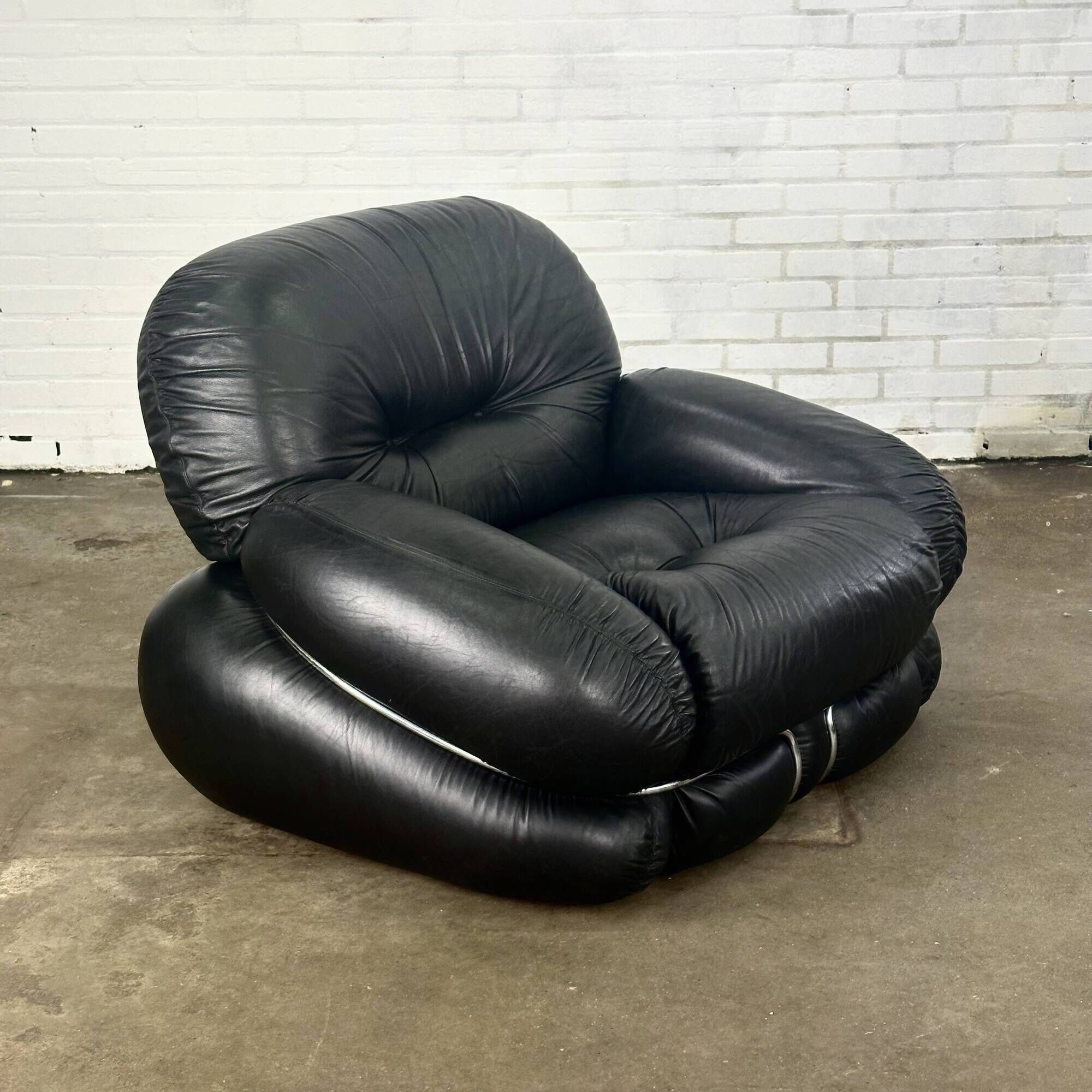Okay armchair by Adriano Piazzesi in black leather with ottoman