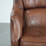 Cognac brown cow leather armchair with decorative nail finish
