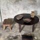 Antique round coffee table in Indonesian teak with turned legs.